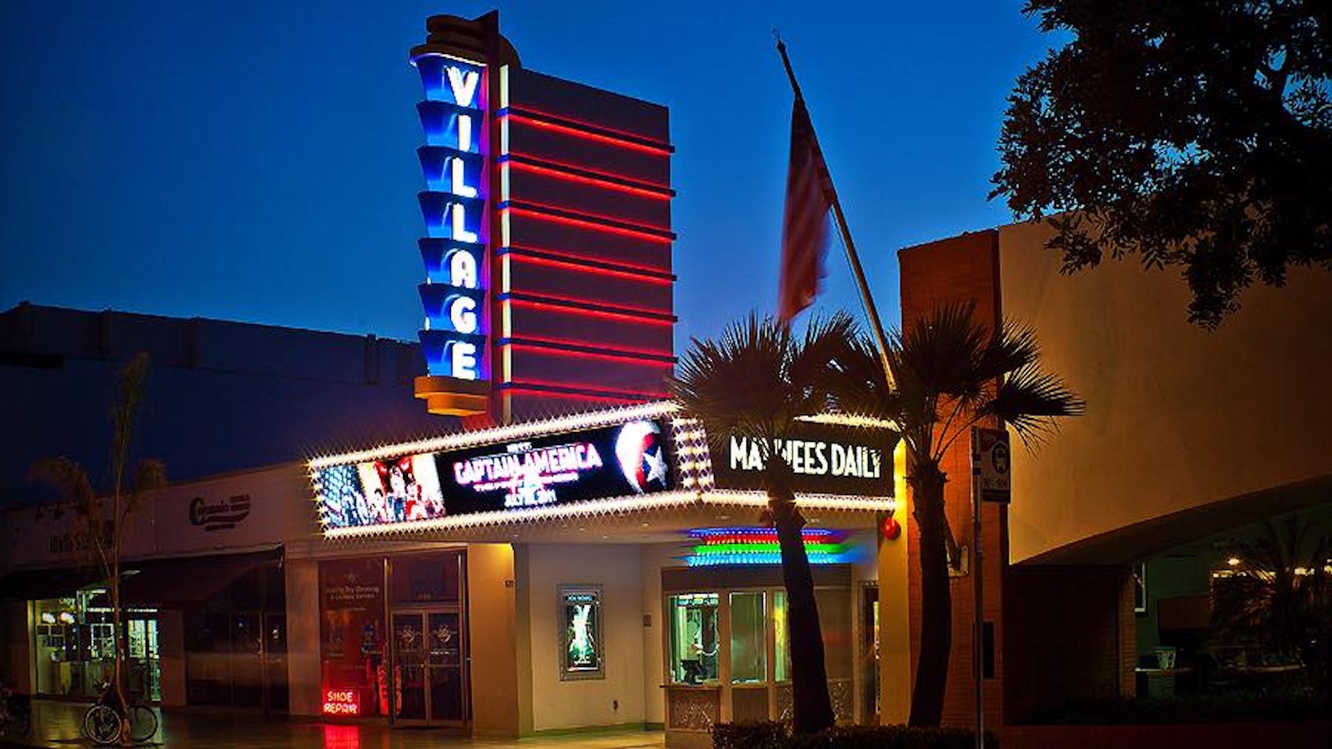 signage of a theater place at night